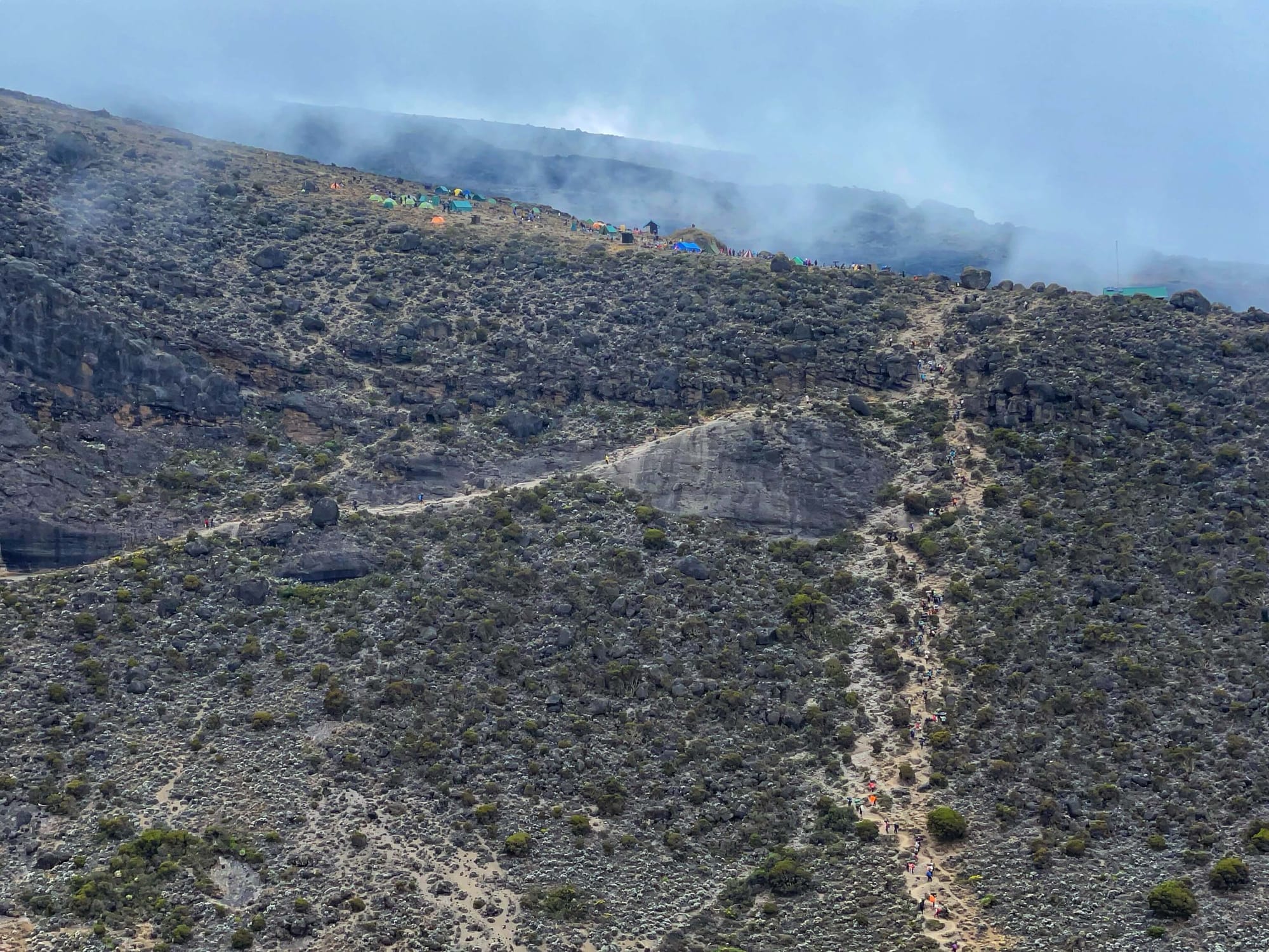 A closer up view of the uphill path, with tents set up on top.