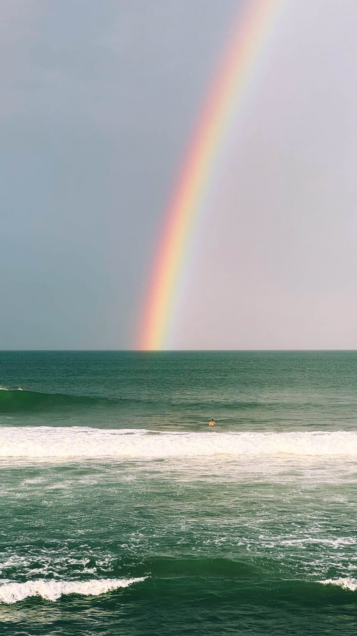 A rainbow over the ocean.