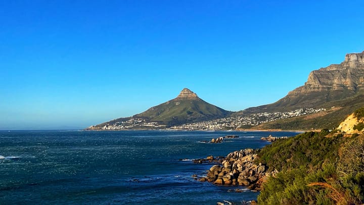 The famous Lion's Head peak in Cape Town looks like a triangle on top of a big hill that rises up from the sea.