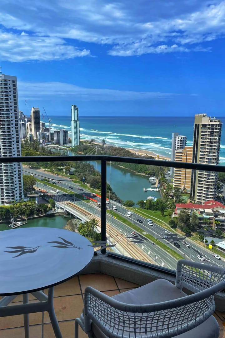 A view of the beach and the skyline of the gold coast from a hotel balcony on a beautiful sunny day.